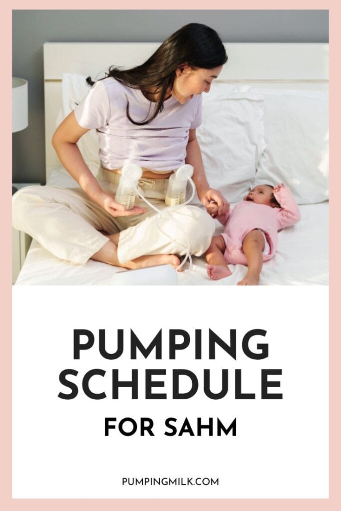 A stay-at-home mom sits cross-legged on a bed using a double electric breast pump while smiling at her baby, who is lying beside her in a pink onesie. The image has a text overlay that reads "Pumping Schedule for SAHM" with the website "PumpingMilk.com" at the bottom. The setting is cozy and relaxed, emphasizing the balance of motherhood and pumping.