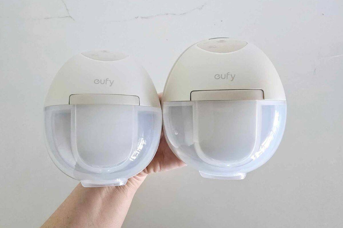 Two Eufy S1 wearable breast pumps held side by side, showing slight design differences in motor and controls.