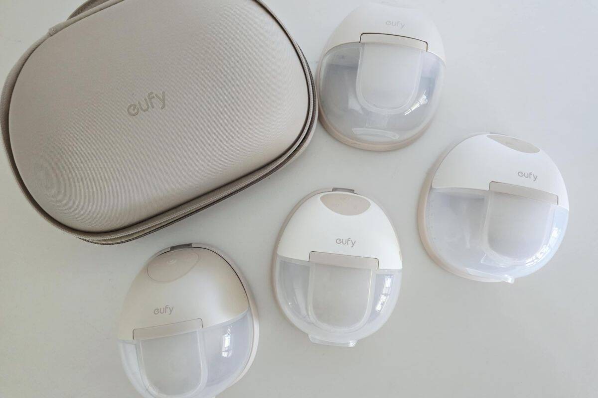 Eufy S1 Pro, S1, E20 and E10 wearable breast pumps displayed on a table alongside a beige Eufy rechargeable carry case.